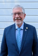 A picture containing person, person, suit, necktieDescription automatically generated